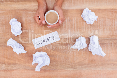 Above view of paper ball and coffee