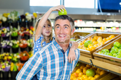 Father giving his daughter a piggy back