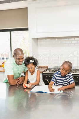 Father with children in the kitchen