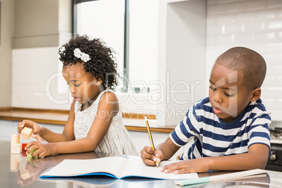 Siblings having fun in the kitchen