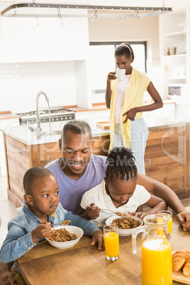 Casual happy family having breakfast