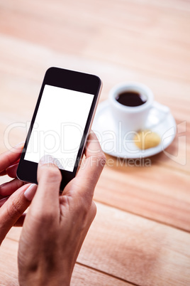 Overhead of feminine hands using smartphone