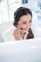 Smiling businesswoman wearing headset