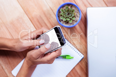 Feminine hands using smartphone