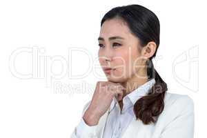 Focused businesswoman with hand on chin