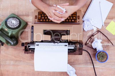 Above view of typewriter and old phone