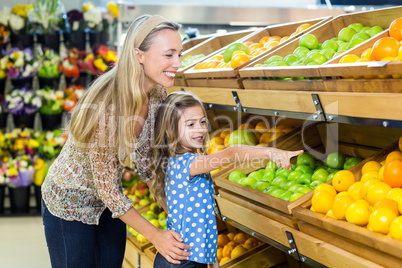 Mother and daughter in grocery shop