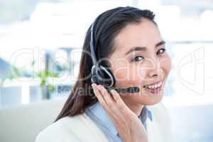 Smiling businesswoman with headset