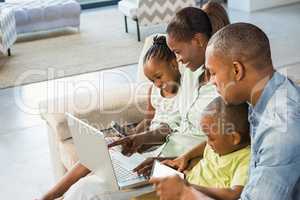 Happy family using technology together