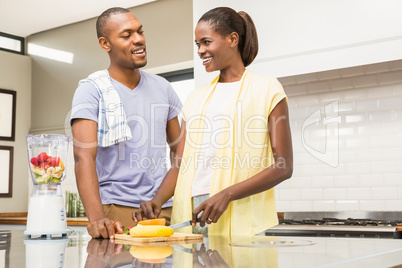 Young casual couple making fruits