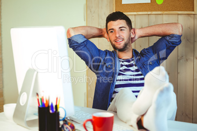 Handsome hipster working at desk