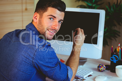 Handsome hipster working at desk