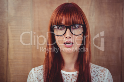 Surprised hipster woman posing face to the camera