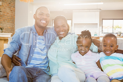 Happy family relaxing on the couch