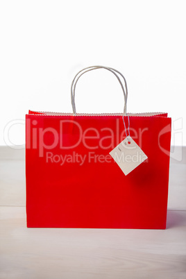 Red shopping gift bag with tag