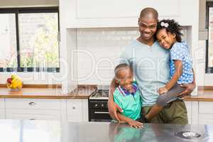 Father and children in the kitchen