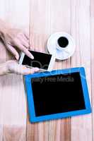 Businesswoman using her smartphone on desk