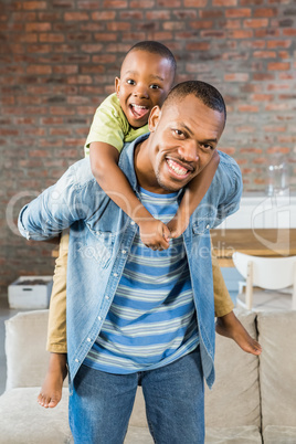 Father and son having fun at home