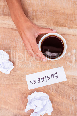 Above view of paper ball and coffee