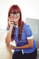 Attractive smiling hipster woman posing