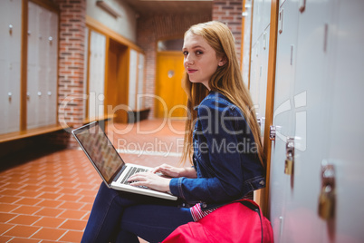 Smiling student sitting at the computer