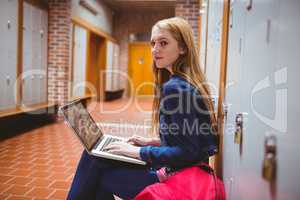 Smiling student sitting at the computer