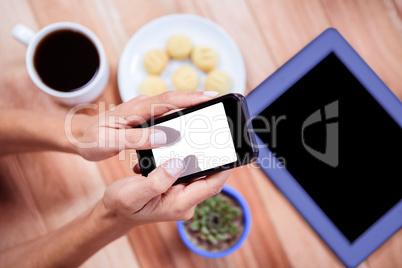 Overhead of feminine hands using smartphone