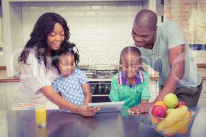 Happy family using tablet