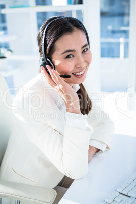 Smiling businesswoman on headset