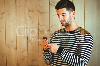 Casual hipster using his phone