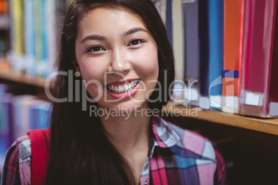 Smiling student in library