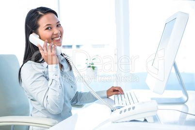 Smiling businesswoman on phone