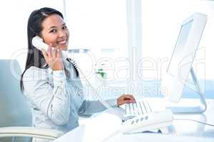 Smiling businesswoman on phone