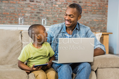 Happy family using technology together