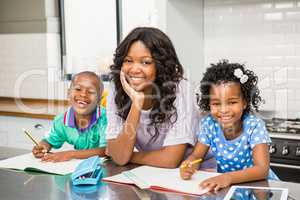 Mother with her children in kitchen