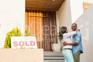 Happy couple after buying new house