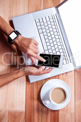 Overhead of hands using smartphone