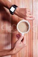 Feminine hands with smart control and coffee