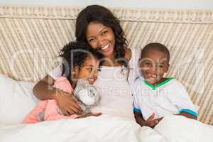 Mother in bed with children