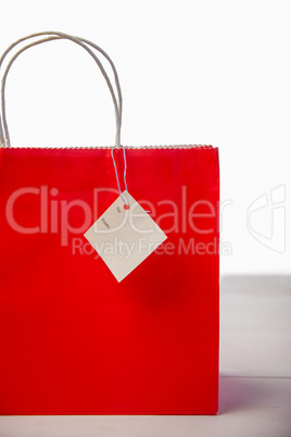 Red shopping gift bag with tag