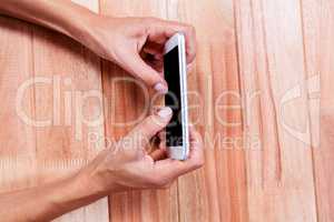 Part of hands typing on smartphone