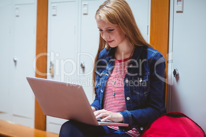 Smiling student sitting at the computer