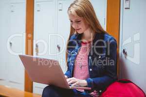 Smiling student sitting at the computer