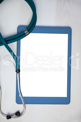 Tablet and stethoscope on desk