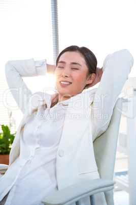 Businesswoman relaxing on her desk