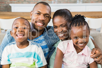 Happy family relaxing on the couch