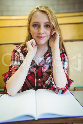 Blonde student smiling at the camera