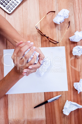 Part of hands making paper ball