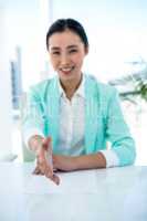 Smiling businesswoman offering a handshake