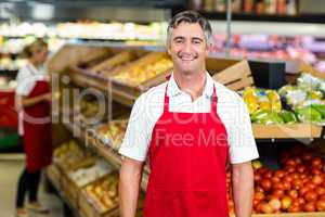 Portrait of smiling man wearing apron